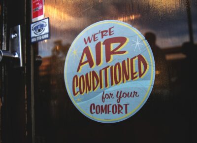 "We're Air Conditioned for your Comfort" Sign