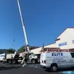 It sounds like a productive day for your team with clear skies providing ideal conditions for the installation. Ensuring that such large equipment is lifted safely and accurately requires a lot of coordination, so having your branded vans nearby likely reassures clients of your professional presence and capabilities. If you haven't already, consider sharing updates or photos on your company’s social media or website to showcase the scale and professionalism of this installation. This can highlight your expertise in handling significant projects and attract potential clients who may need commercial air conditioning services in New Jersey. Make sure all safety protocols are followed during the lift to ensure a smooth process for both your team and anyone around, such as the visitors at Lourdes Urgent Care.