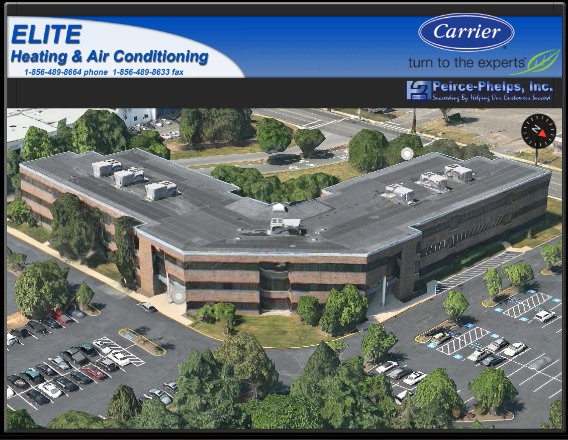 Aerial view of a commercial office building with a parking lot; banners display Elite Heating & Air Conditioning and Carrier branding at the top, highlighting Unusual Commercial HVAC moments in 2025.