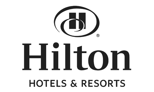 Black and white Hilton Hotels & Resorts logo featuring a stylized H inside an oval above the brand name in bold text.